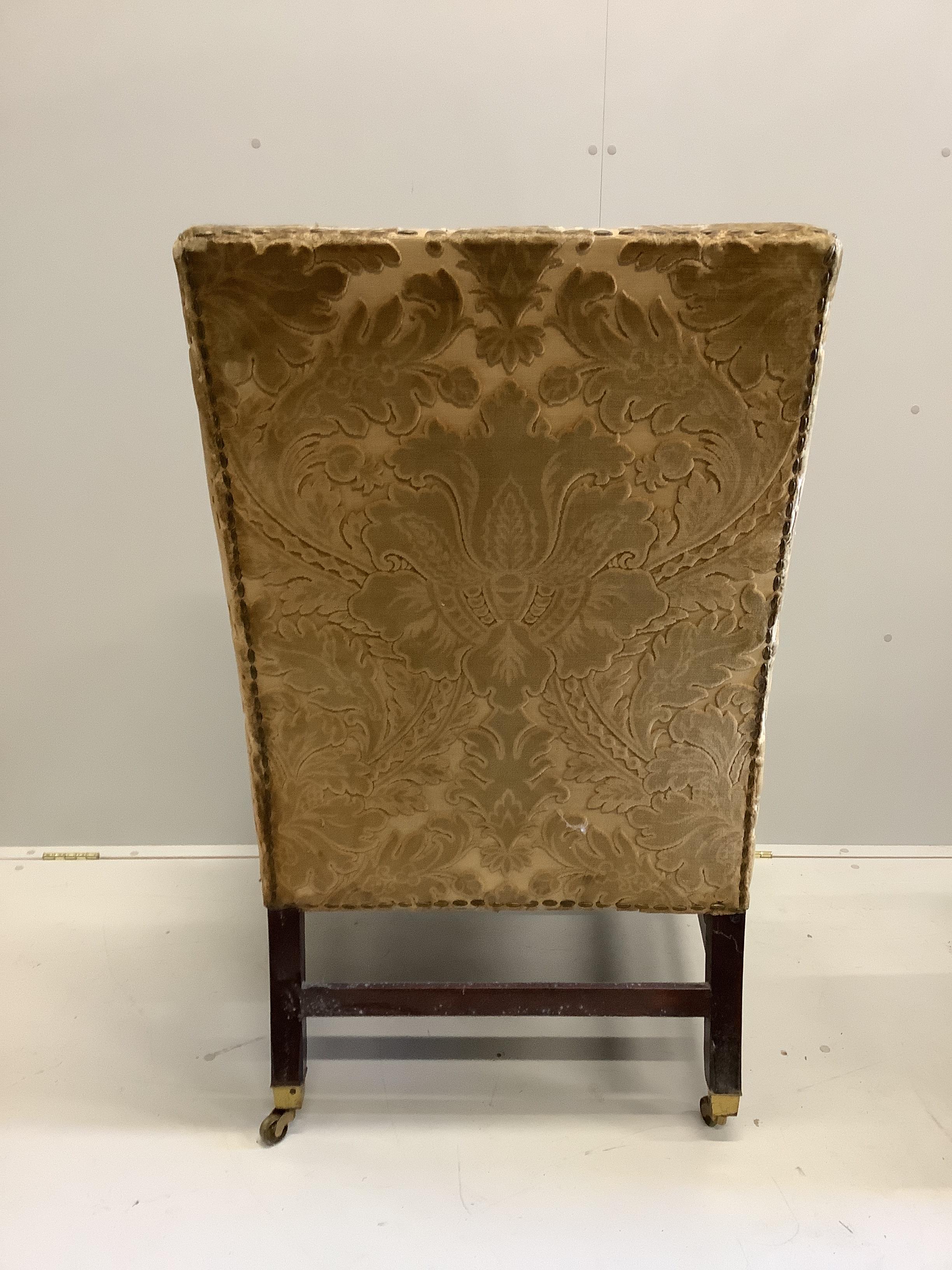 A George III mahogany velvet brocade wingback armchair, for use by Edward VII, width 84cm, depth 76cm, height 116cm